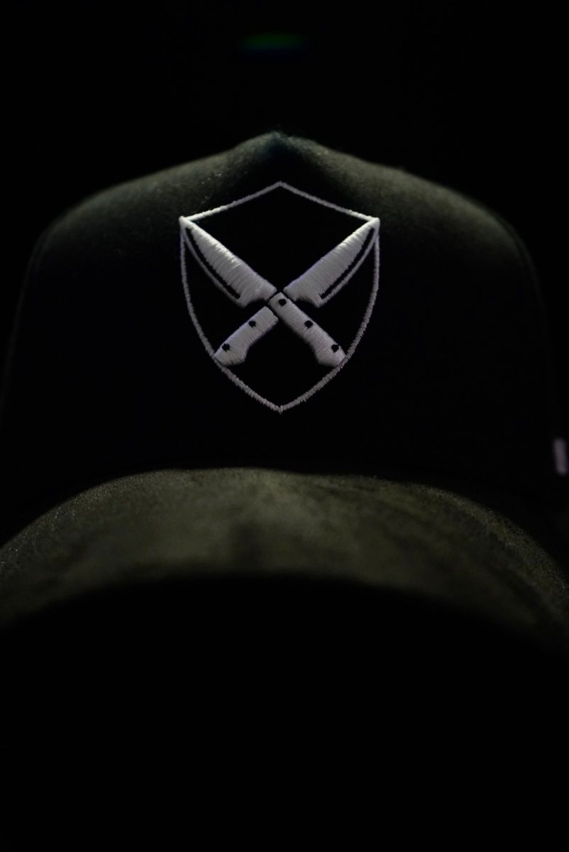 LGC hat, crossed-knives shield